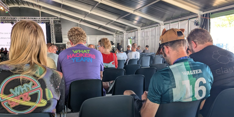 The team from behind listening to a conference